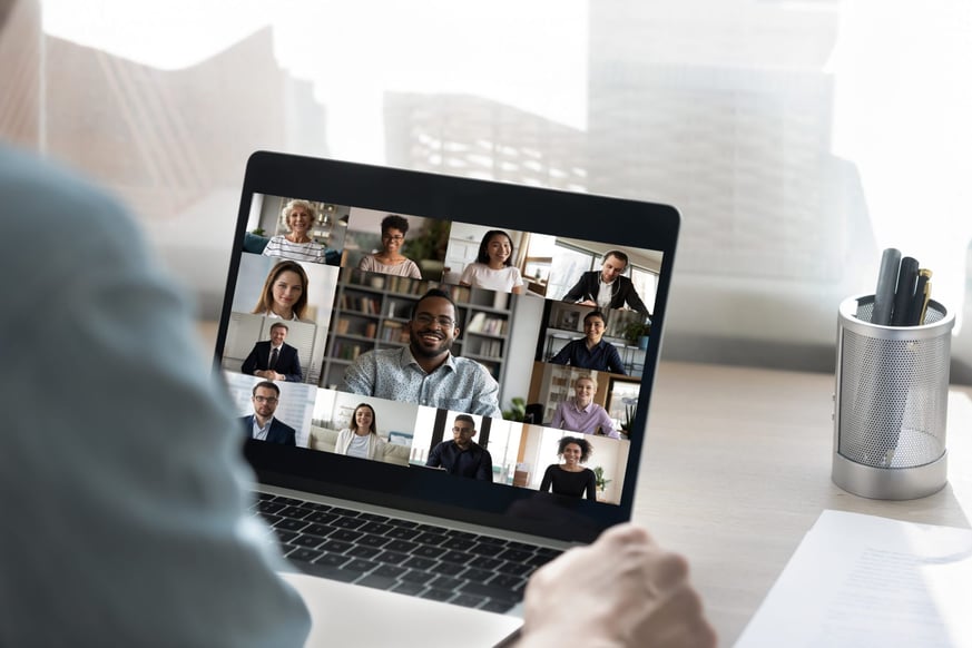 laptop with people on a business video call 
