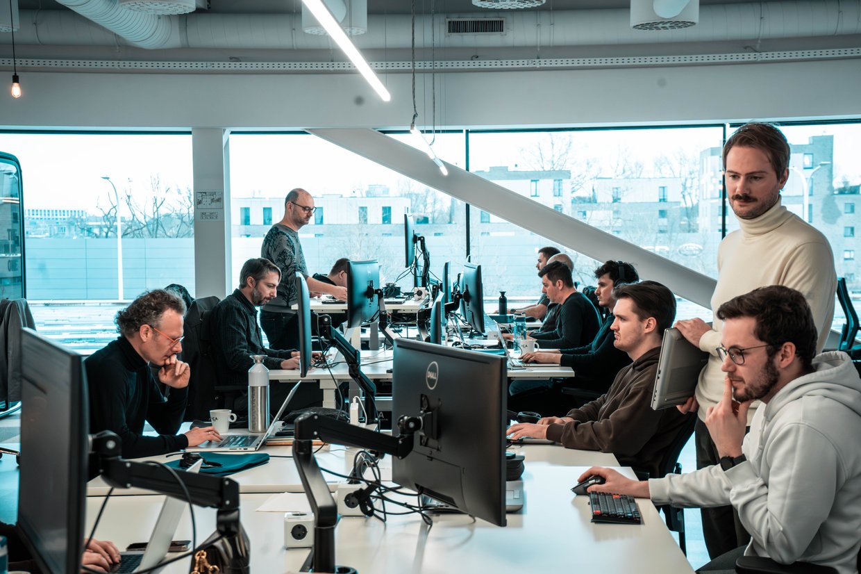 Consultants working in open space at ACA Group