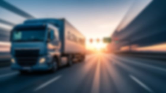 blurred truck on road