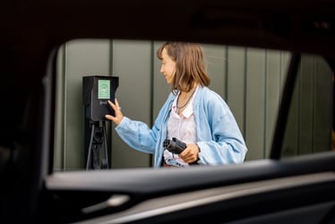 woman charging car at home-ecofix woman charging car at home-ecofix